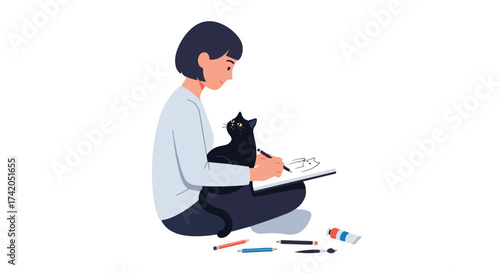 A woman artist, sitting on the floor, is drawing a picture of her adorable cat in her sketchbook, surrounded by painting and art supplies