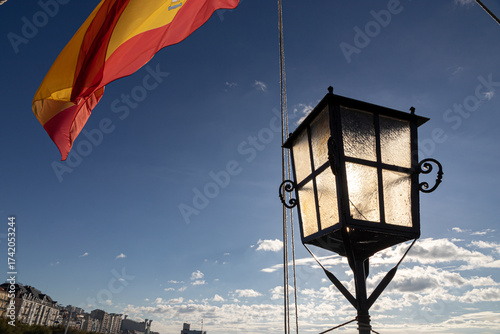 Santander, Spain. Stern lantern and large Spanish flag waving in the wind on the 2017 replica of the nao Santa Maria, the flagship of Christopher Columbus 1492 expedition, docked at the port