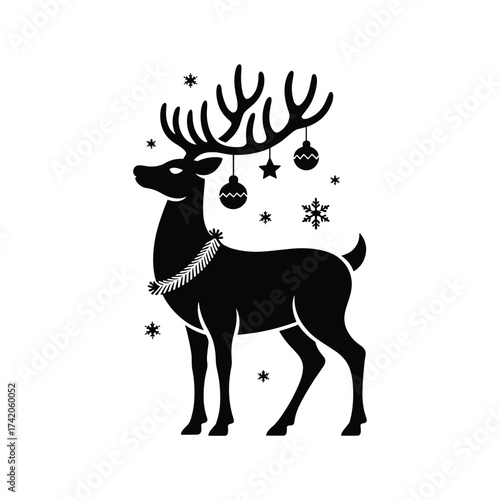 Festive silhouette of a reindeer with antler ornaments and snowflakes for christmas decorations