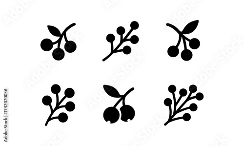 Simple black silhouette icons of berry branches on white background