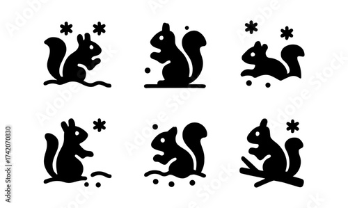 Playful squirrel silhouettes set with seasonal elements and stars