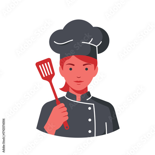 A female chef in uniform holds a spatula, ready to prepare delicious food in a professional kitchen setting.
