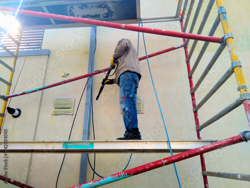Repair of the facade of a private house, washing and painting the walls