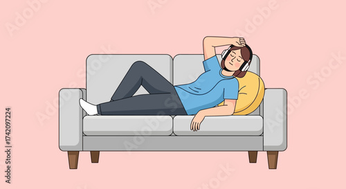 Person lying on couch with headphones on, listening to music and relaxing at home, enjoying downtime and leisure