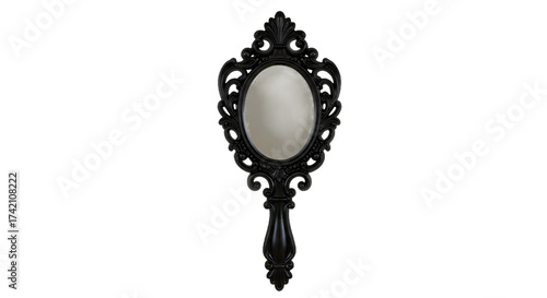 Fényképezés Ornate Black Handheld Mirror with Decorative Frame Against a Dark Background