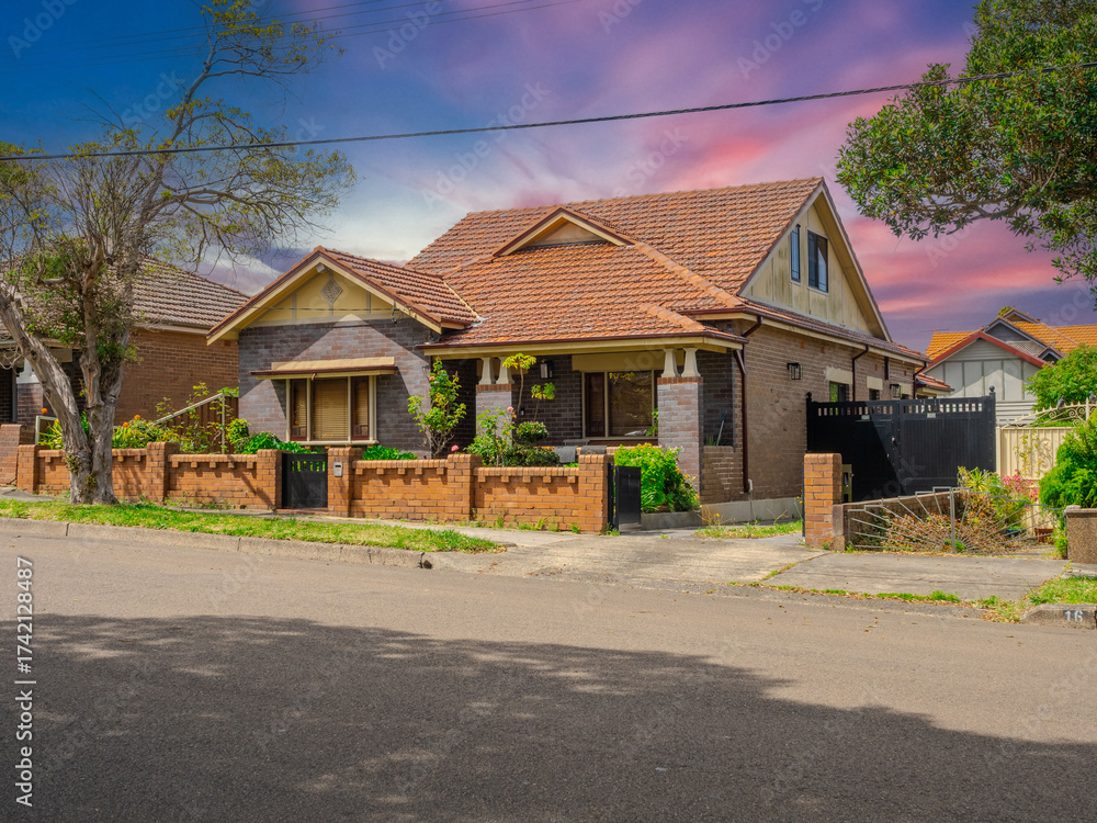 Obraz premium Beautiful colours of a Spring Sunset over Residential houses in inner Sydney suburb of Ashbury NSW Australia Double Brick federation house western sydney 