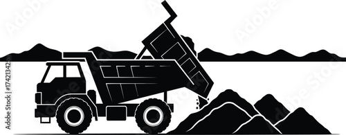 Heavy dump truck unloading dirt and rocks creating piles outdoors