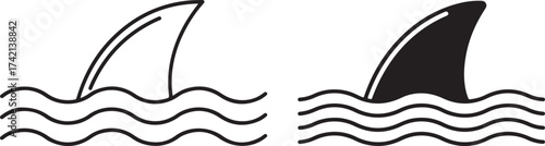 Two shark fins breaking water silhouette