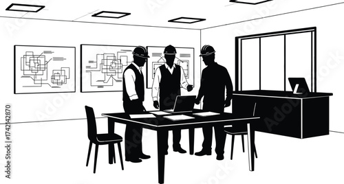 Three engineers review plans at a table with laptop in office editable stock