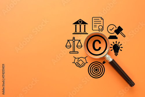 Copyright and intellectual property law concept. A magnifying glass focuses on the copyright symbol surrounded by icons of justice, contracts, and patents for the legal protection of creative work.