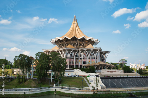 Wallpaper Mural View from across the Sarawak River, the new Sarawak State Legislative Assembly building. The cross-section of the building is a golden pavilion and is shaped like a nine-pointed star. Kuching, Borneo  Torontodigital.ca