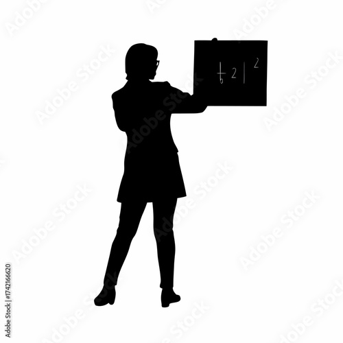 Silhouette of a teacher writing math equations on a chalkboard isolated on white background