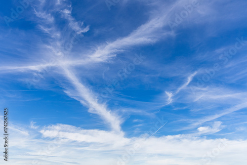 blue sky with white fluffy clouds during the day (focal length 33 mm)	

