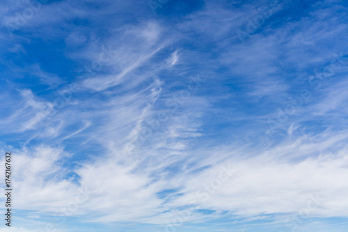 blue sky with white fluffy clouds during the day (focal length 43 mm)	
