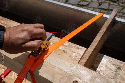 Securing cargo with a tension belt