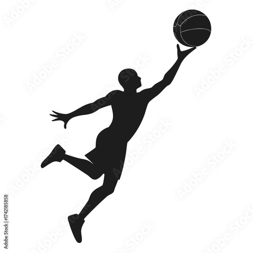 Silhouette of a basketball player jumping to dunk the ball in mid air