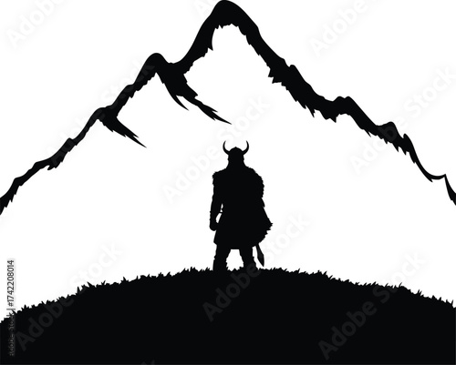 Silhouette of viking warrior standing before a mountain range editable stock