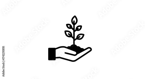Hand holding a young plant with soil symbolizing growth and environmental care.