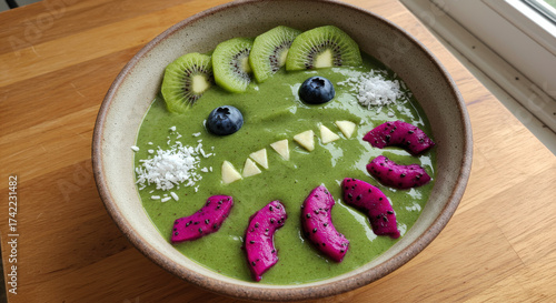 Halloween healthy breakfast monster with spiky teeth and colorful fruits