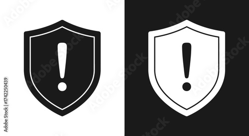 Warning shield icon with exclamation mark in black and white silhouette