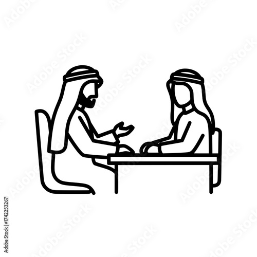 Two Arab men in traditional attire having a discussion at a table.