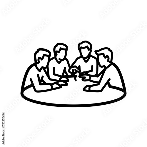 Four people sitting around a table discussing a project together.