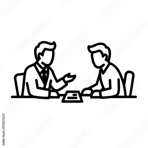 Two people are sitting at a table and having a discussion.