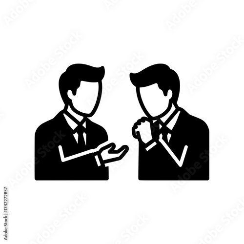 Two businessmen in suits talking and gesturing during a meeting.