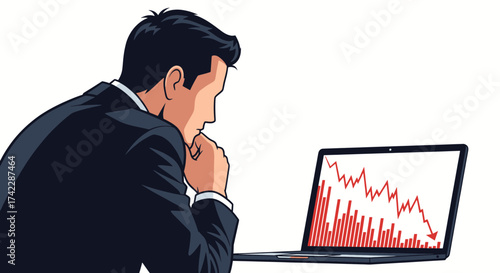 Businessman looking at a laptop screen with a declining graph.