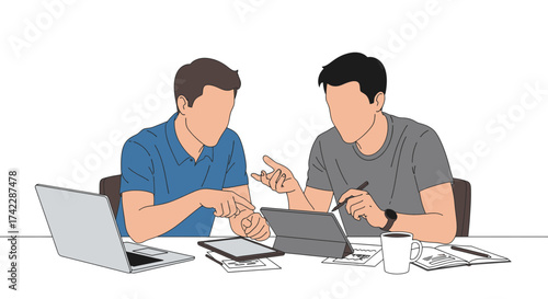 Two men are working together on a project using technology and discussing ideas.