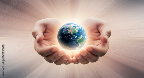 Hands holding a globe against a modern, luminous background.   A symbol of environmental protection and sustainable development.