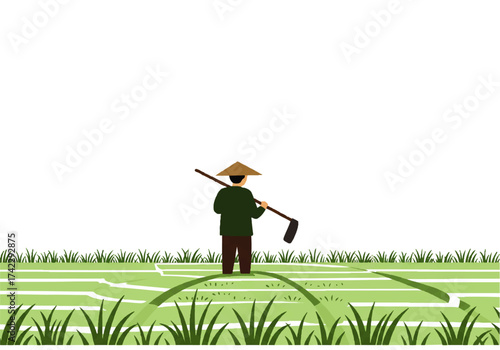 A farmer with a conical hat stands in a rice paddy, holding a farming tool over his shoulder.
