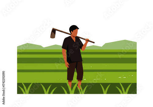 A farmer stands in a rice field, carrying a hoe over his shoulder, with mountains in the background.