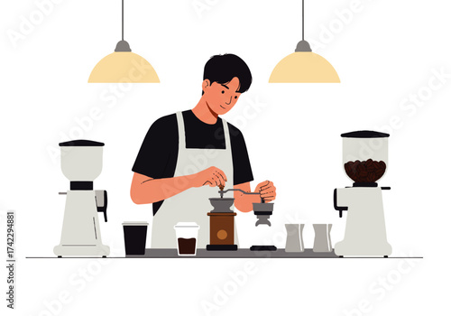 A young barista in an apron grinds coffee beans using a manual grinder, with coffee grinders and cups nearby.