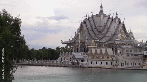 Glass Ubosot in the middle of the Bang Pakong River, Wat Phuttha Promyan Chachoengsao Province, Thailand