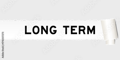 Ripped gray paper background that have word long term under torn part