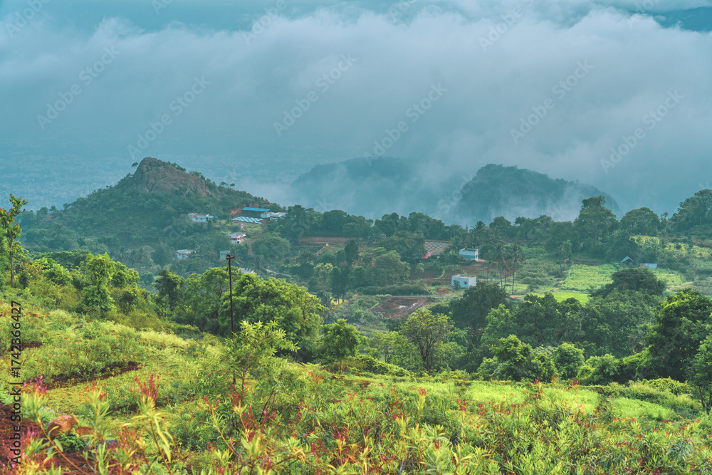 Naklejka premium A mountain range with a town in the valley