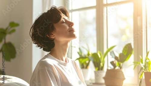 Woman breathing by window with houseplants, morning sunlight and mindful living