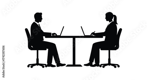 Silhouettes of business people working on laptops at a table facing each other in office setting isolated on white background silhouette design isolated on white background