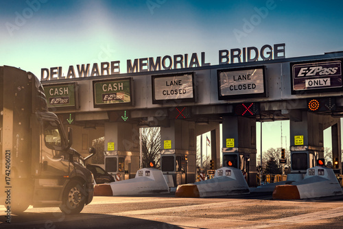 Large truck driving to bridge toll plaza