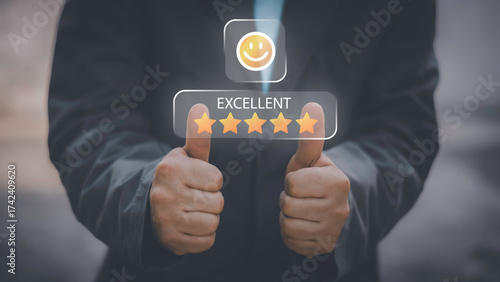 Businessman using smartphone to give five-star positive review with smiley face icon, Customers give 5-star reviews,symbolizing excellent customer feedback, and user satisfaction in digital service.