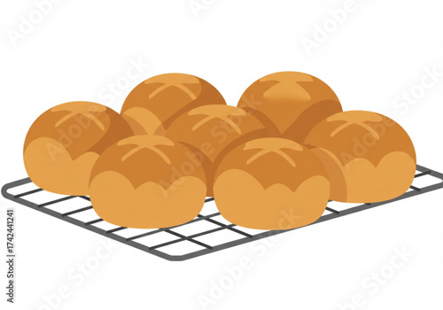 Freshly baked brioche bread rolls on a cooling rack  