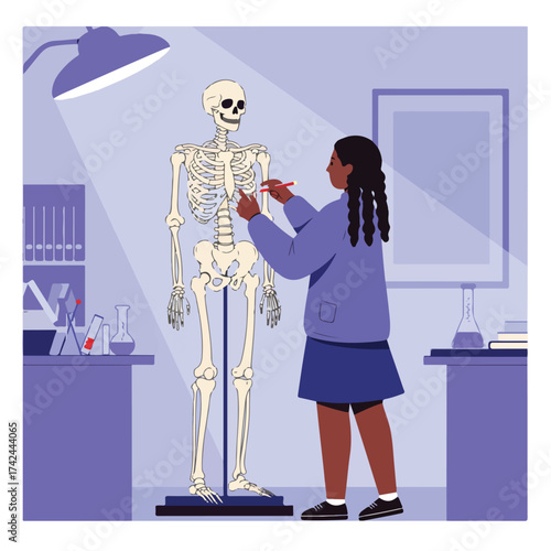 Student studies human skeleton with a pen in a lab