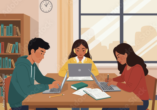 Three students are studying together at a library table, using laptops and books for research and writing.