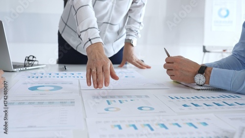 Valokuva Business team analyzing financial charts and graphs during corporate meeting, fo