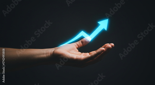Watch your business grow exponentially with this upward trending success arrow held in your hand, symbolizing prosperity and positive direction forward
