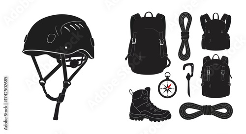 Essential climbing gear collection including helmet backpack and navigation tools