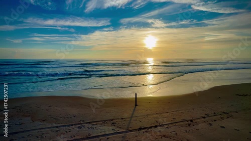 relaxing beach scene at sunrise on the coast