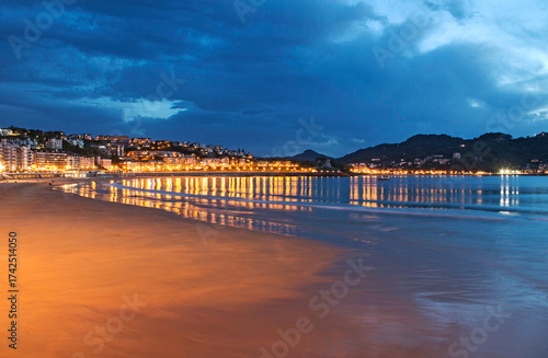 Blue hour, dusk, on La Concha beach in San Sebastian, Spain