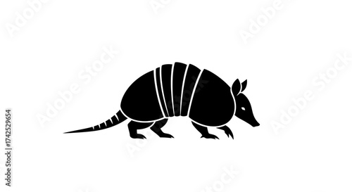 Simple black armadillo silhouette walking vector icon.